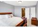 Bedroom with double bed, access to hallway and light wood dresser at 5340 Thompson Park Blvd, Indianapolis, IN 46237