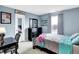 Bedroom with twin bed, desk, and dresser at 5340 Thompson Park Blvd, Indianapolis, IN 46237