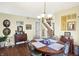 Bright dining room with a round table and hardwood floors at 5340 Thompson Park Blvd, Indianapolis, IN 46237
