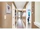 Long hallway with taupe walls and carpet at 5340 Thompson Park Blvd, Indianapolis, IN 46237