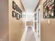 Long hallway with taupe walls and carpet at 5340 Thompson Park Blvd, Indianapolis, IN 46237