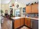 Open kitchen with breakfast bar and view of Gathering room at 5340 Thompson Park Blvd, Indianapolis, IN 46237
