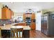 Modern kitchen with stainless steel appliances and wood cabinets at 5340 Thompson Park Blvd, Indianapolis, IN 46237