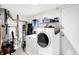 Basement laundry room with washer, dryer, and storage at 5340 Thompson Park Blvd, Indianapolis, IN 46237
