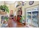 Spacious living room with hardwood floors, fireplace, and access to backyard patio at 5340 Thompson Park Blvd, Indianapolis, IN 46237