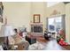 Gathering room with fireplace, hardwood floors, and ample space for play at 5340 Thompson Park Blvd, Indianapolis, IN 46237