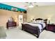 Main bedroom with king-size bed and built-in shelving at 5340 Thompson Park Blvd, Indianapolis, IN 46237