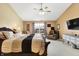 Spacious main bedroom with king-size bed and sitting area at 5340 Thompson Park Blvd, Indianapolis, IN 46237