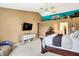 Main bedroom with a king-size bed and a sitting area at 5340 Thompson Park Blvd, Indianapolis, IN 46237