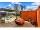 Cozy patio with seating area, fire pit, and wood storage at 5340 Thompson Park Blvd, Indianapolis, IN 46237