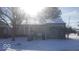 Tan single story home with snow covered yard at 5473 E 19Th St, Indianapolis, IN 46218