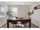 Well-lit dining room featuring a wood table with seating for four and natural light at 5766 Aleppo Ln, Greenwood, IN 46143