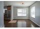 Bright dining area with hardwood floors and large windows at 6027 Central Ave, Indianapolis, IN 46220