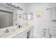 Bright bathroom with a vanity, shower, and large mirror at 611 Dellingham Dr # B, Indianapolis, IN 46260