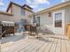 Cozy wooden deck perfect for outdoor dining and entertaining featuring a grill and chairs at 619 Fair Ave, Shelbyville, IN 46176