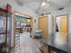 Bright dining room provides a view of the kitchen and is furnished with a table and chairs at 619 Fair Ave, Shelbyville, IN 46176
