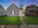 Charming home with a well-maintained lawn, inviting porch and stone walkway, great for curb appeal at 619 Fair Ave, Shelbyville, IN 46176
