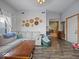 Comfortable living room with hardwood floors, a large sofa, and an open layout, creating a welcoming atmosphere at 619 Fair Ave, Shelbyville, IN 46176
