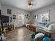 Inviting living room with hardwood floors, a large sofa, and plenty of natural light, perfect for relaxation at 619 Fair Ave, Shelbyville, IN 46176