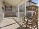 Inviting front porch with a porch swing and rocking chair, offering a relaxing outdoor space at 619 Fair Ave, Shelbyville, IN 46176