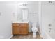 Clean bathroom with a shower/tub combo and wood vanity at 626 Port Dr, Avon, IN 46123