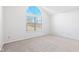 Bright bedroom with neutral carpeting and an arched window at 626 Port Dr, Avon, IN 46123