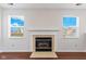 Bright living room features a fireplace and hardwood floors at 626 Port Dr, Avon, IN 46123