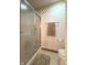 Clean bathroom with shower stall and neutral-toned tile flooring at 650 Davis Ct, Indianapolis, IN 46234