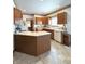 Spacious kitchen featuring wood cabinets, ample counter space, and modern appliances at 650 Davis Ct, Indianapolis, IN 46234