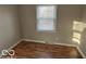 Bedroom with hardwood floors and window coverings at 6735 Dorchester Ct, Indianapolis, IN 46214