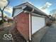 White garage door and brick exterior wall at 6735 Dorchester Ct, Indianapolis, IN 46214