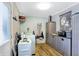 Laundry room with washer, dryer, storage cabinets, and vinyl flooring at 7120 Lockwood Ln, Indianapolis, IN 46217