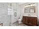 Updated bathroom with a walk-in shower and vanity at 7239 Fulham Dr, Indianapolis, IN 46250