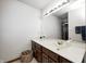Clean bathroom with a vanity, sink, and mirror at 7425 Cherryhill Dr, Indianapolis, IN 46254