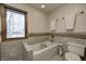 Bathroom with tile flooring and a bathtub at 7425 Cherryhill Dr, Indianapolis, IN 46254