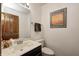 Small bathroom with single vanity and toilet at 7425 Cherryhill Dr, Indianapolis, IN 46254