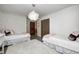 Girly bedroom with twin beds, gold polka dots, and fluffy rug at 7425 Cherryhill Dr, Indianapolis, IN 46254