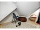 Large bonus room with inversion table and beanbag chair at 7425 Cherryhill Dr, Indianapolis, IN 46254