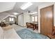 Spacious bonus room with seating area, game table, and plenty of natural light at 7425 Cherryhill Dr, Indianapolis, IN 46254