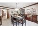 Formal dining room with an oval table, wooden buffet, and chandelier at 7425 Cherryhill Dr, Indianapolis, IN 46254