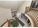 Top-down view of a grand entryway with a curved staircase at 7425 Cherryhill Dr, Indianapolis, IN 46254