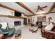 Cozy Gathering room with a fireplace and exposed wood beams at 7425 Cherryhill Dr, Indianapolis, IN 46254
