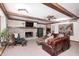 Spacious Gathering room with a fireplace and leather furniture at 7425 Cherryhill Dr, Indianapolis, IN 46254