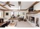 Gathering room features a brick fireplace and large bay window at 7425 Cherryhill Dr, Indianapolis, IN 46254