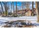 Two-story home with brick exterior, nestled in a wooded setting at 7425 Cherryhill Dr, Indianapolis, IN 46254