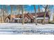 Brick two-story house with a gabled roof and snow-covered lawn at 7425 Cherryhill Dr, Indianapolis, IN 46254