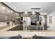 Modern kitchen with gray cabinets, granite counters, and stainless steel appliances at 7425 Cherryhill Dr, Indianapolis, IN 46254