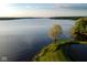 Peaceful lake view with lush green shoreline, perfect for relaxation at 7425 Cherryhill Dr, Indianapolis, IN 46254