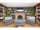Charming library with built-in shelves and a cozy fireplace at 7425 Cherryhill Dr, Indianapolis, IN 46254
