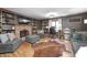 Spacious library with built-in shelves, hardwood floors and a fireplace at 7425 Cherryhill Dr, Indianapolis, IN 46254